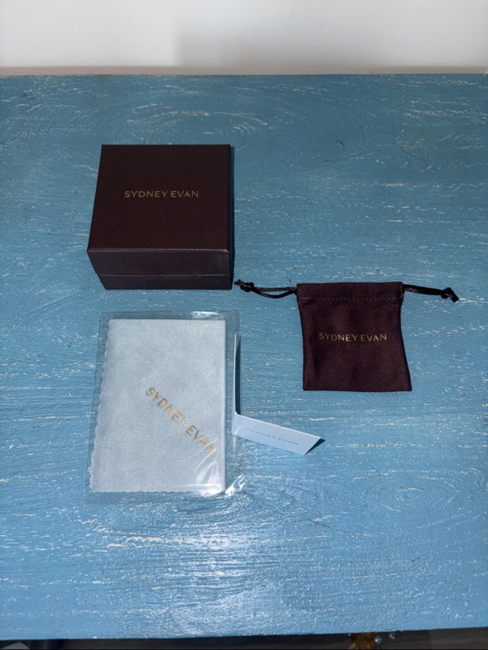 Brand new Sydney Evan box , pouch and jewelry cleaning pad